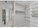 Walk-in closet with built-in shelving and ample space for organizing clothes and accessories at 2909 Timpani Trl, Apex, NC 27539