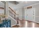 Inviting foyer with hardwood floors, staircase and neutral paint at 2909 Timpani Trl, Apex, NC 27539