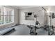 Home gym featuring modern exercise equipment and natural light at 2909 Timpani Trl, Apex, NC 27539