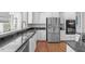 Modern kitchen featuring stainless steel appliances, sleek counters, and lots of cabinetry at 2909 Timpani Trl, Apex, NC 27539