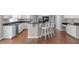 Modern kitchen with white cabinets, a dark countertop and stainless steel appliances at 2909 Timpani Trl, Apex, NC 27539