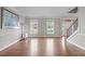 Bright living area with hardwood floors, staircase, and ample natural light at 2909 Timpani Trl, Apex, NC 27539