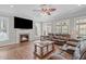 Cozy living room featuring a fireplace, hardwood floors and lots of natural light at 2909 Timpani Trl, Apex, NC 27539