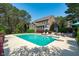 Large pool and patio area provides lots of space to enjoy the outdoors and features lounge seating at 2909 Timpani Trl, Apex, NC 27539