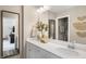 Elegant bathroom featuring a white vanity with quartz countertop and decorative elements at 293 Providence Creek Dr, Fuquay Varina, NC 27526