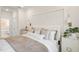 Bright bedroom featuring soft lighting, elegant linens, and a decorative headboard for a peaceful ambiance at 293 Providence Creek Dr, Fuquay Varina, NC 27526
