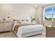 Inviting bedroom with soft lighting, decorative headboard, and neutral tones for a comfortable ambiance at 293 Providence Creek Dr, Fuquay Varina, NC 27526
