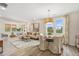 Bright living area includes a comfortable beige sofa, a round dining table, and bright natural light at 293 Providence Creek Dr, Fuquay Varina, NC 27526