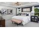 Well-lit main bedroom features a king-size bed, modern decor, and large windows at 293 Providence Creek Dr, Fuquay Varina, NC 27526