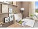 Cozy office space with neutral walls, built-in shelves, and a well-lit work area at 293 Providence Creek Dr, Fuquay Varina, NC 27526