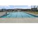 Community pool with clear blue water, surrounded by a concrete deck and neighborhood homes at 293 Providence Creek Dr, Fuquay Varina, NC 27526