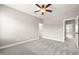 Spacious bedroom with neutral walls, plush carpeting, and a ceiling fan at 2936 Turning Brook Ln, Raleigh, NC 27616