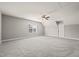 Spacious bonus room featuring neutral walls, plush carpeting, and a ceiling fan for added comfort at 2936 Turning Brook Ln, Raleigh, NC 27616