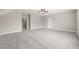 Large bonus room showcasing neutral walls, plush carpeting, and a bright, open layout at 2936 Turning Brook Ln, Raleigh, NC 27616