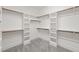 Walk-in closet with shelving, hanging racks, and carpet at 2936 Turning Brook Ln, Raleigh, NC 27616