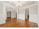 Open dining room with hardwood floors and decorative trim, showcasing seamless transitions at 2936 Turning Brook Ln, Raleigh, NC 27616