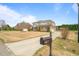 Beautiful two-story brick home with a well-manicured front yard at 2936 Turning Brook Ln, Raleigh, NC 27616