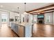 Open-concept kitchen featuring an island, stainless steel appliances, and views of the living area at 2936 Turning Brook Ln, Raleigh, NC 27616