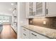 Kitchen area featuring granite countertops, custom cabinets, and stainless appliances at 2936 Turning Brook Ln, Raleigh, NC 27616