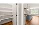 Walk-in pantry with white shelving near the kitchen at 2936 Turning Brook Ln, Raleigh, NC 27616