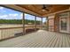 Comfortable screened porch with ceiling fan overlooks a lush yard at 2936 Turning Brook Ln, Raleigh, NC 27616