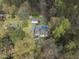 Expansive property with mature trees features a pool, deck, garage, and a well-maintained home at 2949 Tram Rd, Fuquay Varina, NC 27526