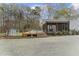 Backyard view of in-ground pool, screened porch, and storage shed at 2949 Tram Rd, Fuquay Varina, NC 27526
