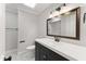 Neutral bathroom featuring a dark vanity and a soaking tub/shower combo at 2949 Tram Rd, Fuquay Varina, NC 27526