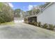 Home with garage and screened in porch with a large driveway at 2949 Tram Rd, Fuquay Varina, NC 27526