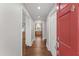 Inviting foyer with hardwood floors, leading to a bright kitchen with natural light at 2949 Tram Rd, Fuquay Varina, NC 27526