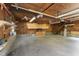 Spacious garage featuring ample storage cabinets, shelving, and ceiling fans at 2949 Tram Rd, Fuquay Varina, NC 27526