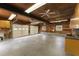 Spacious garage with ample lighting, storage, and windows at 2949 Tram Rd, Fuquay Varina, NC 27526