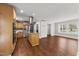 Open-concept kitchen seamlessly flowing into the spacious living area with hardwood floors at 2949 Tram Rd, Fuquay Varina, NC 27526
