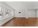 Spacious living room with hardwood floors, lots of natural light and neutral wall color at 2949 Tram Rd, Fuquay Varina, NC 27526