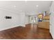 Bright living room and open kitchen with recessed lighting and hardwood floors throughout the space at 2949 Tram Rd, Fuquay Varina, NC 27526