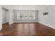 Bright living room with hardwood floors, recessed lighting and built in storage at 2949 Tram Rd, Fuquay Varina, NC 27526