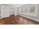 Bright living room with hardwood floors, recessed lighting and built in storage at 2949 Tram Rd, Fuquay Varina, NC 27526