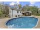 Back of home with above ground pool and beautiful deck, perfect for outdoor entertaining at 2949 Tram Rd, Fuquay Varina, NC 27526