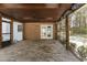 Relaxing screened porch with brick floor and wood ceiling with ceiling fan at 2949 Tram Rd, Fuquay Varina, NC 27526