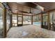 Inviting screened porch with views of a swimming pool and wooden deck at 2949 Tram Rd, Fuquay Varina, NC 27526