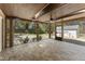 Inviting screened porch with brick floor and views of the yard and driveway at 2949 Tram Rd, Fuquay Varina, NC 27526