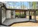 Well-designed back deck with a covered patio, outdoor grill, and access to the home's interior at 302 Rutherglen Dr, Cary, NC 27511