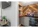 Stylish bar area with wood chevron backsplash, storage, and beverage cooler at 302 Rutherglen Dr, Cary, NC 27511