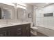 Bathroom with double vanity, toilet and shower with white subway tile at 302 Rutherglen Dr, Cary, NC 27511