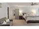 Spacious primary bedroom with sitting area, neutral decor, and ample natural light at 302 Rutherglen Dr, Cary, NC 27511