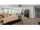 Serene bedroom featuring neutral tones, recessed lighting, and plentiful windows at 302 Rutherglen Dr, Cary, NC 27511