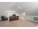 Large bonus room with carpeted floors, seating area, and natural light at 302 Rutherglen Dr, Cary, NC 27511