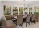 Bright dining area with large windows, custom seating, and modern chandelier at 302 Rutherglen Dr, Cary, NC 27511