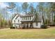 Stunning home exterior with a manicured lawn, porch, and beautifully painted brick at 302 Rutherglen Dr, Cary, NC 27511