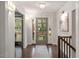 Bright foyer with hardwood floors, a modern light fixture, and a view to the front door at 302 Rutherglen Dr, Cary, NC 27511